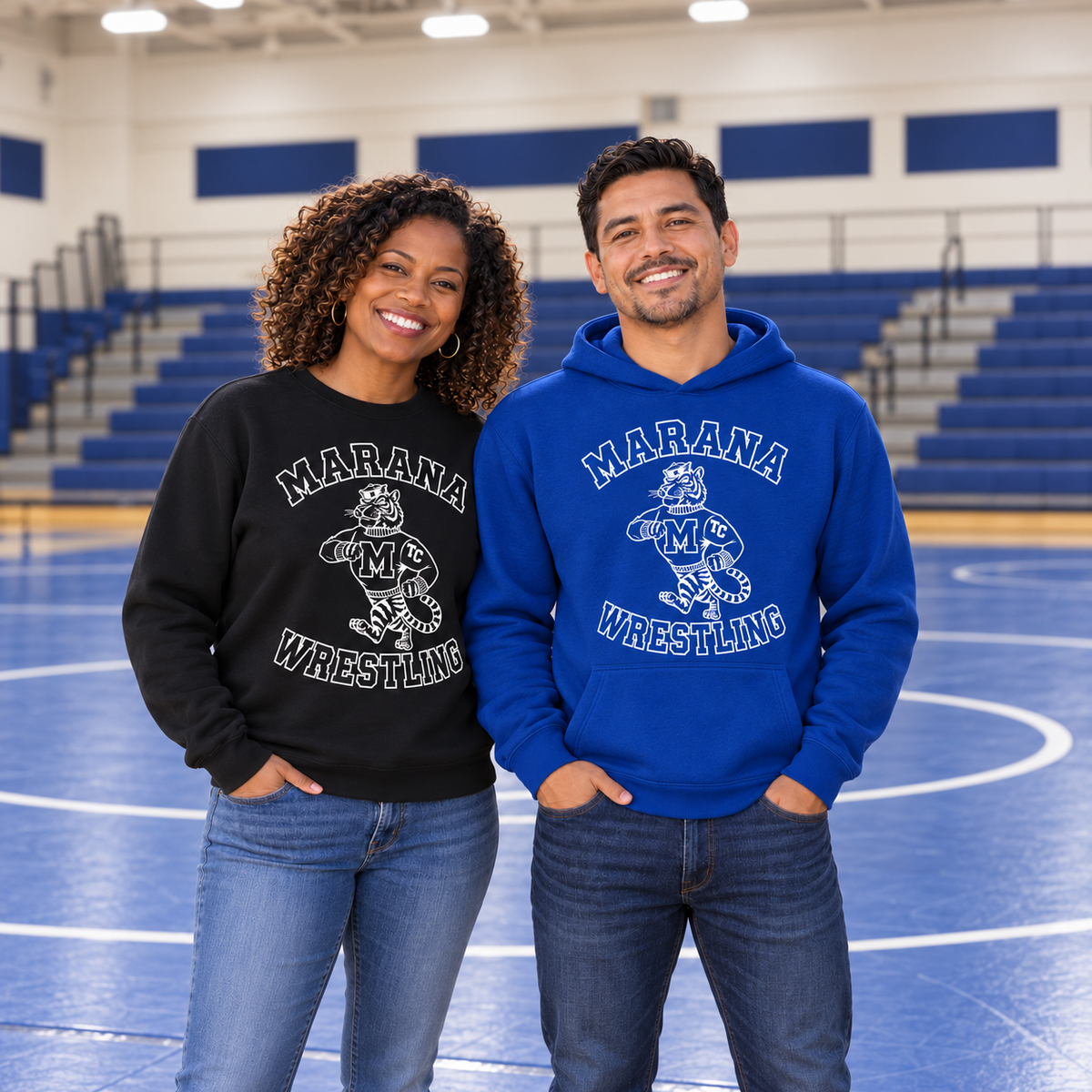 White Marana Wrestling vintage tiger design on a black crewneck and blue hoodie, with two adult models fully framed inside a wrestling gym.